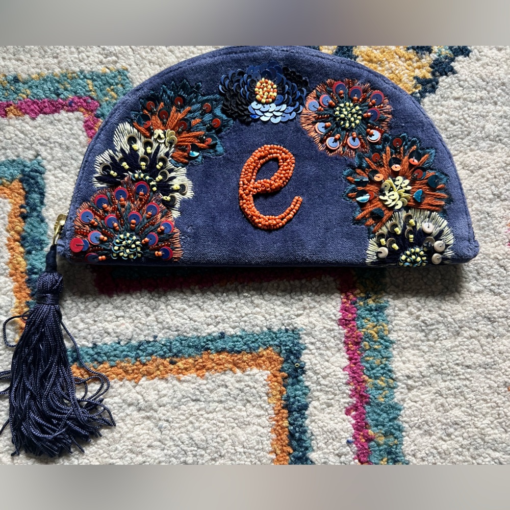 Anthropologie Navy and Orange Embroidered Clutch with Tassel “E”